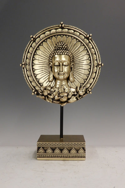 Round shape Lord Buddha face and lotus design below the face on a golden base of a stand for your home or office decoration