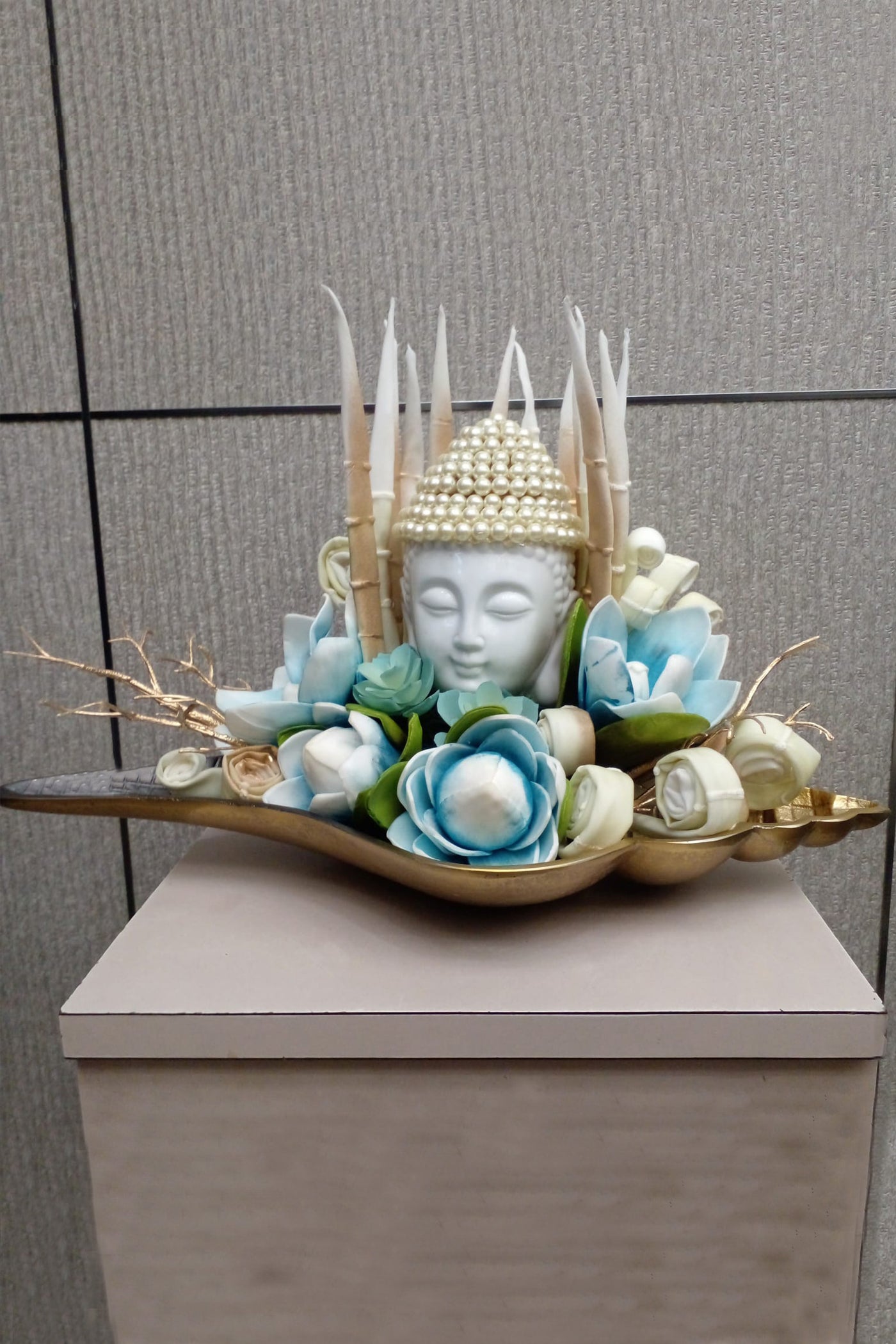 Stunning Ceramic Buddha in a Blue Floral arrangement.